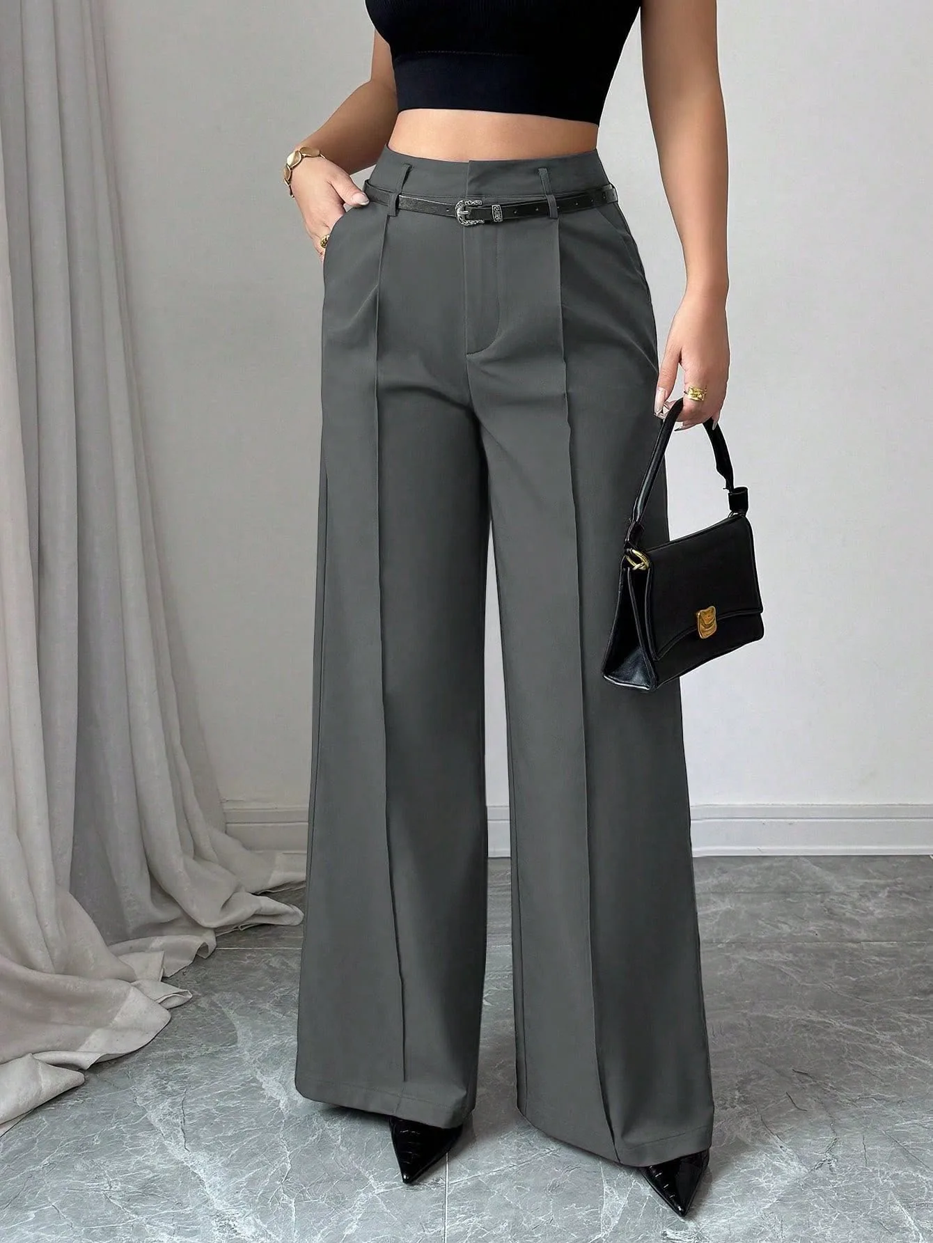 Classy, comfy, and effortlessly chic! 🤎 High-waist wide-leg pants with a flattering fit—perfect for office wear, casual days, or a dressy look. 👖✨ ✔️ High waist ✔️ Wide-leg / flowy fit ✔️ Elegant gray color ✔️ Easy to pair with any top ✔️ Comes with belt loops + stylish belt