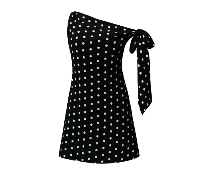 Create a realistic fashion showcase of the exact black-and-white polka-dot dress shown in the reference image. Keep the dress design, colors, polka-dot pattern, silhouette, tie detail, fabric, and proportions completely unchanged. Show an elegant AI female model wearing the dress against a clean, simple background. Slowly showcase the dress from multiple flattering angles, including a front view, slight side view, and close-up of the waist, polka-dot texture, neckline, and tied shoulder detail. Add subtle natural movement to the fabric so the material and shape are clearly visible. Include graceful hand movements gently touching and highlighting the dress without covering its details. Use smooth camera movement, soft studio lighting, realistic fabric texture, and a premium fashion-advertisement look. No alterations to the original dress design.