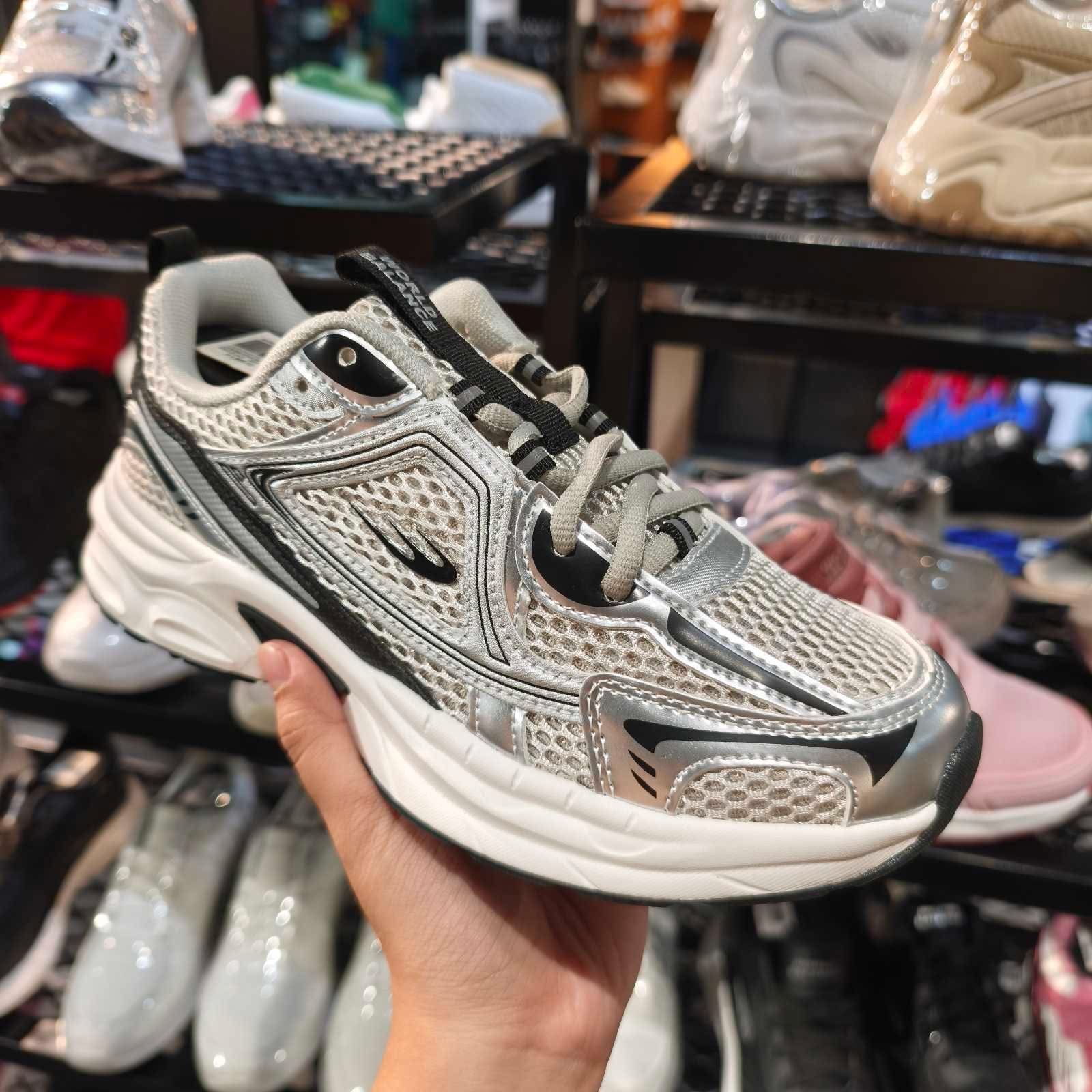 Create a high-quality, eye-catching 15–20 second promotional video for a World Balance lifestyle sneaker based on the uploaded product photo. Start with a close-up cinematic shot of the sneaker, slowly rotating to reveal its silver, white, and black design, textured upper, detailed overlays, thick cushioned-looking sole, and modern sporty silhouette. Transition to a young Filipino lifestyle model wearing the shoes while walking confidently in a clean urban setting. Show different angles of the sneaker—side view, front view, and walking shot. Use smooth camera movements, natural lighting, and stylish commercial-quality visuals. Highlight the sneaker as a fashionable everyday choice for casual outfits, mall trips, walking, travel, school, work, and weekend activities. Add dynamic text overlays: “STYLE THAT MOVES WITH YOU 👟” “SPORTY • STYLISH • EVERYDAY READY” “WORLD BALANCE” End with a strong product close-up and an engaging call-to-action: “Upgrade your everyday look. 🛒 Check it out now!” Make the video look like a professional footwear advertisement—clean, premium, energetic, realistic, and suitable for TikTok, Facebook Reels, and affiliate marketing. Important: Keep the shoe design, colors, logo, shape, and details faithful to the uploaded product photo. Do not change the actual product appearance or add unrealistic features.
